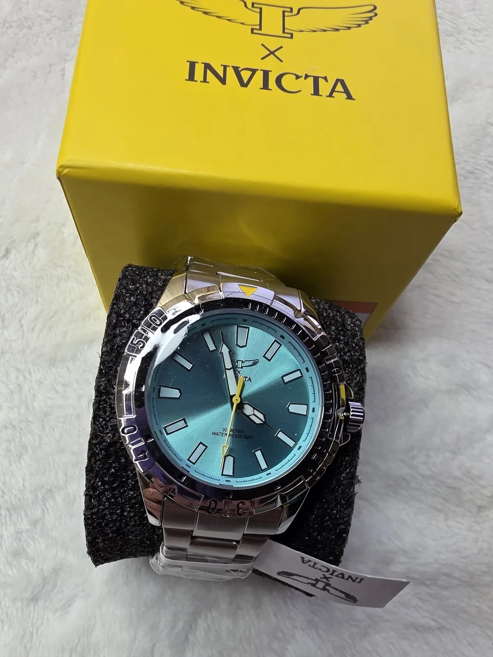 Invicta Men’s Silver Watch with Teal Dial and Yellow Accent 70051